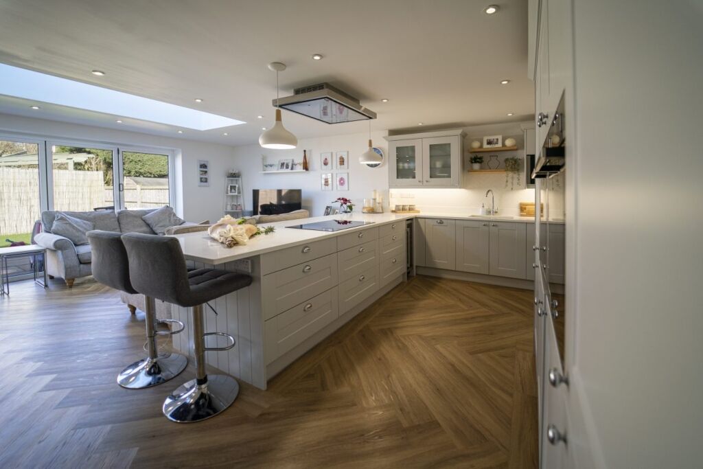 Aspen Shimmer Quartz island adjacent to a modern living area