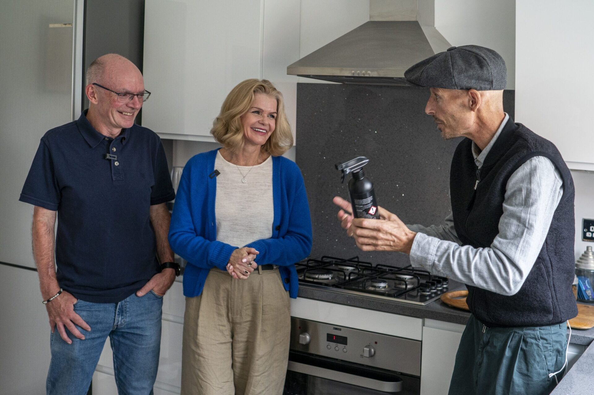 Testimonial kitchen with Grey Starlight Quartz splashback behind the hob and matching worktop run