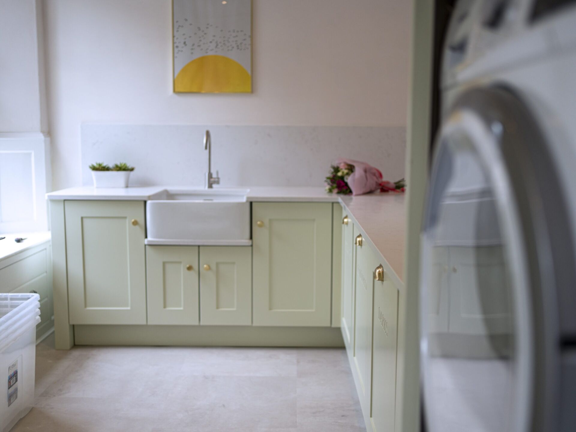 Completed laundry room featuring Carrara Quartz worktops with white inset sink