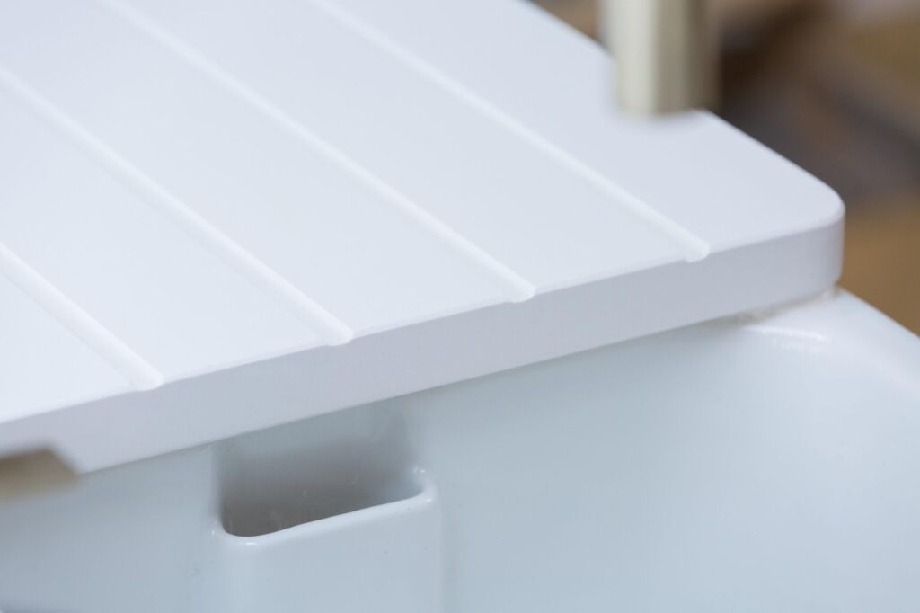 Blanco Zeus Quartz drainer grooves close-up showing crisp channels and a bright white sink run finish