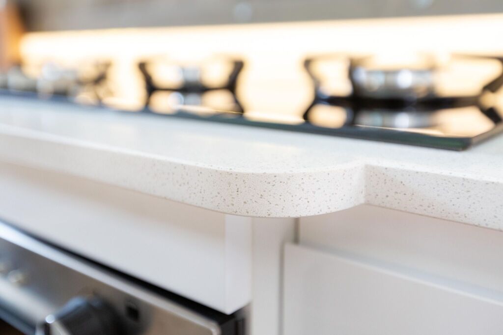 Ice White Quartz worktop edge detail showing a rounded front profile in a narrow boat galley