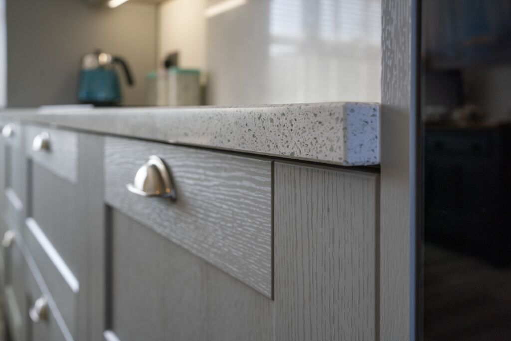 White Starlight Quartz worktop edge above drawer front showing clean finish detail