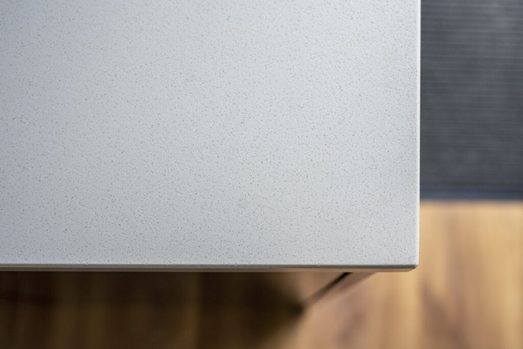 Side view of an Imperial White Quartz worktop showing the thickness and polished edge profile