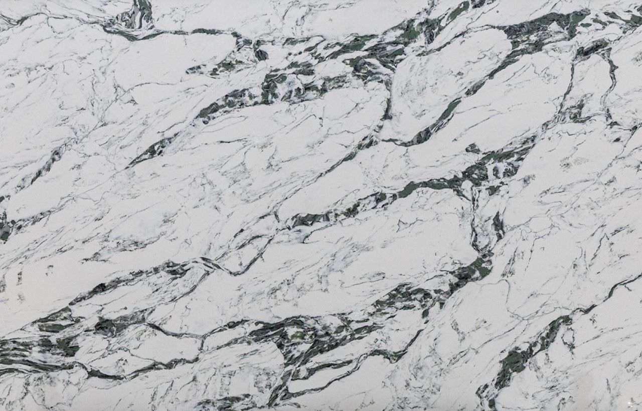 Emerald Calacatta Quartz slab close-up with bold dark green veining and white marble-effect background