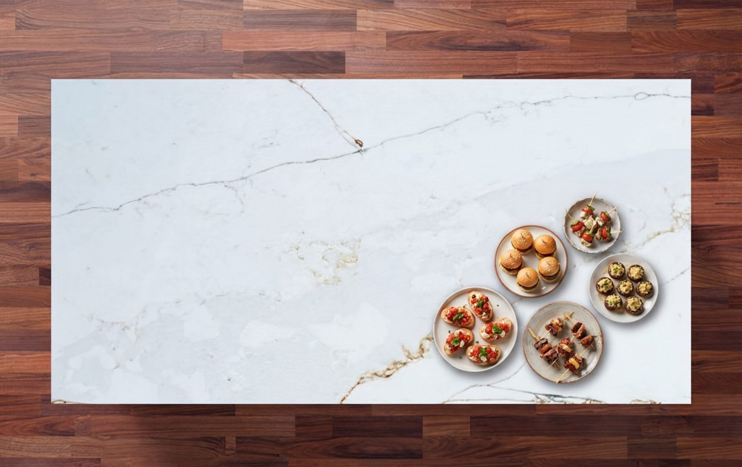 Overhead view of Ethereal Calacatta Quartz worktop showing gold and grey veining on a bright white surface with food dishes