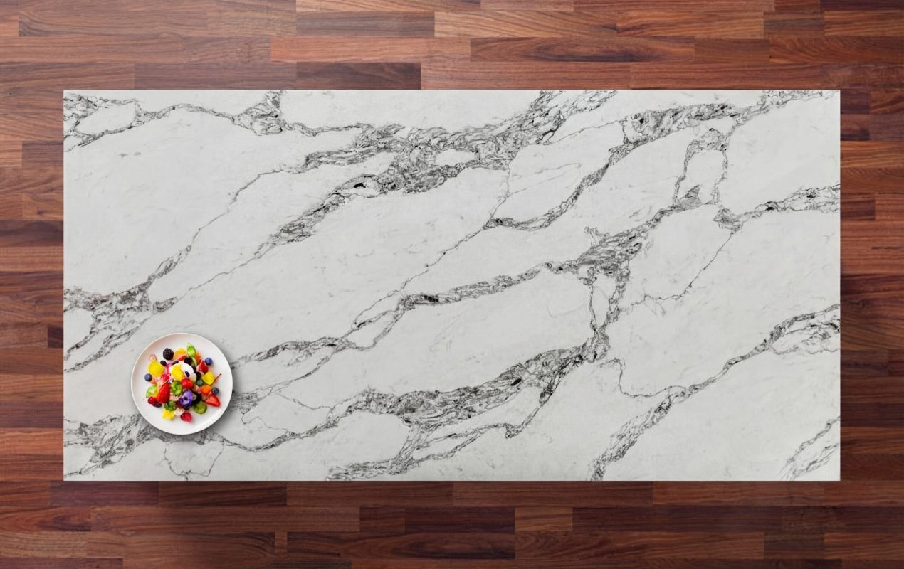 Ivory Calacatta Quartz worktop shown from above with sweeping grey veining across a bright white marble-effect surface