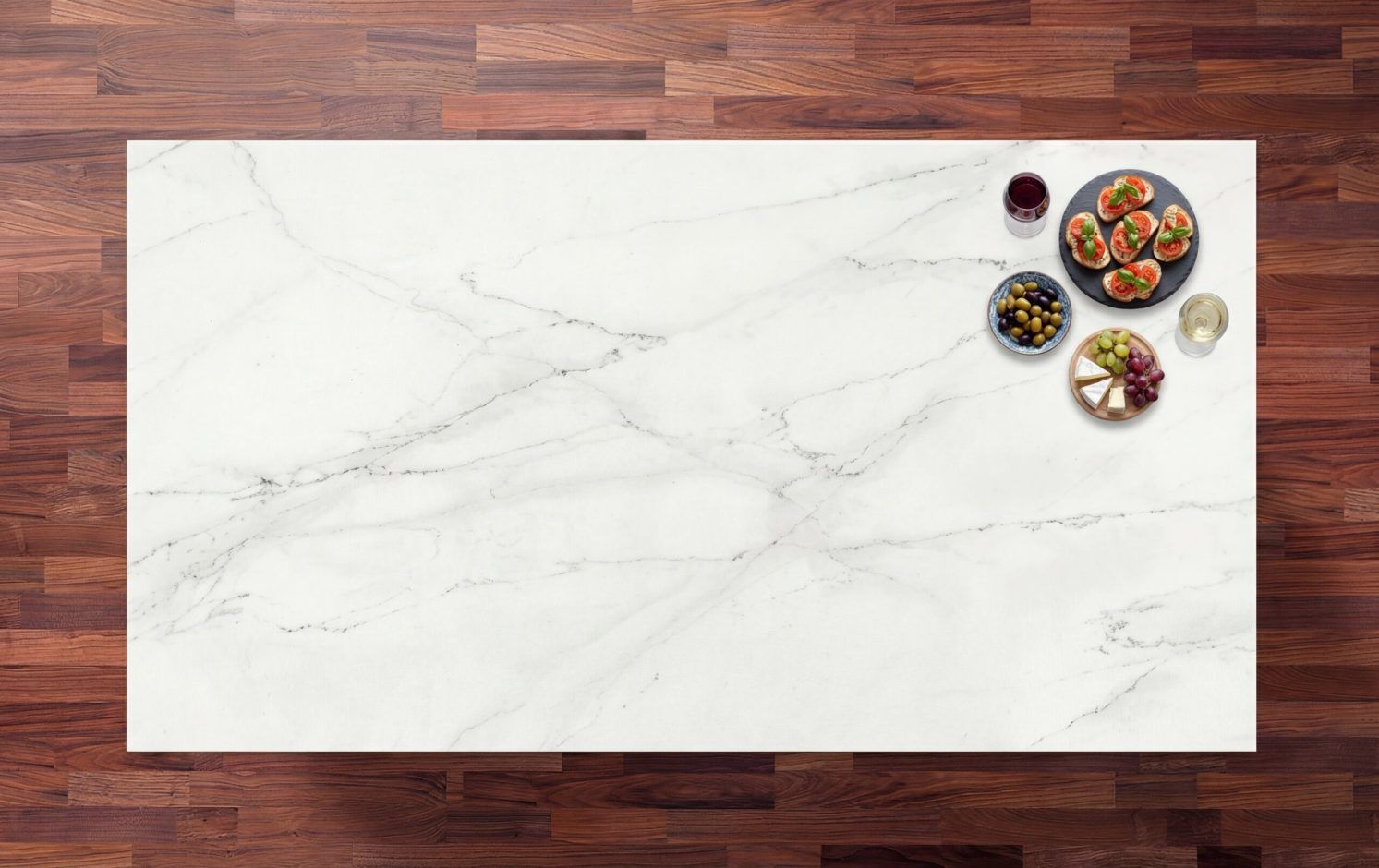 Rem Porcelain worktop in bright white with soft grey veining, styled with spices and small bowls on a timber surround