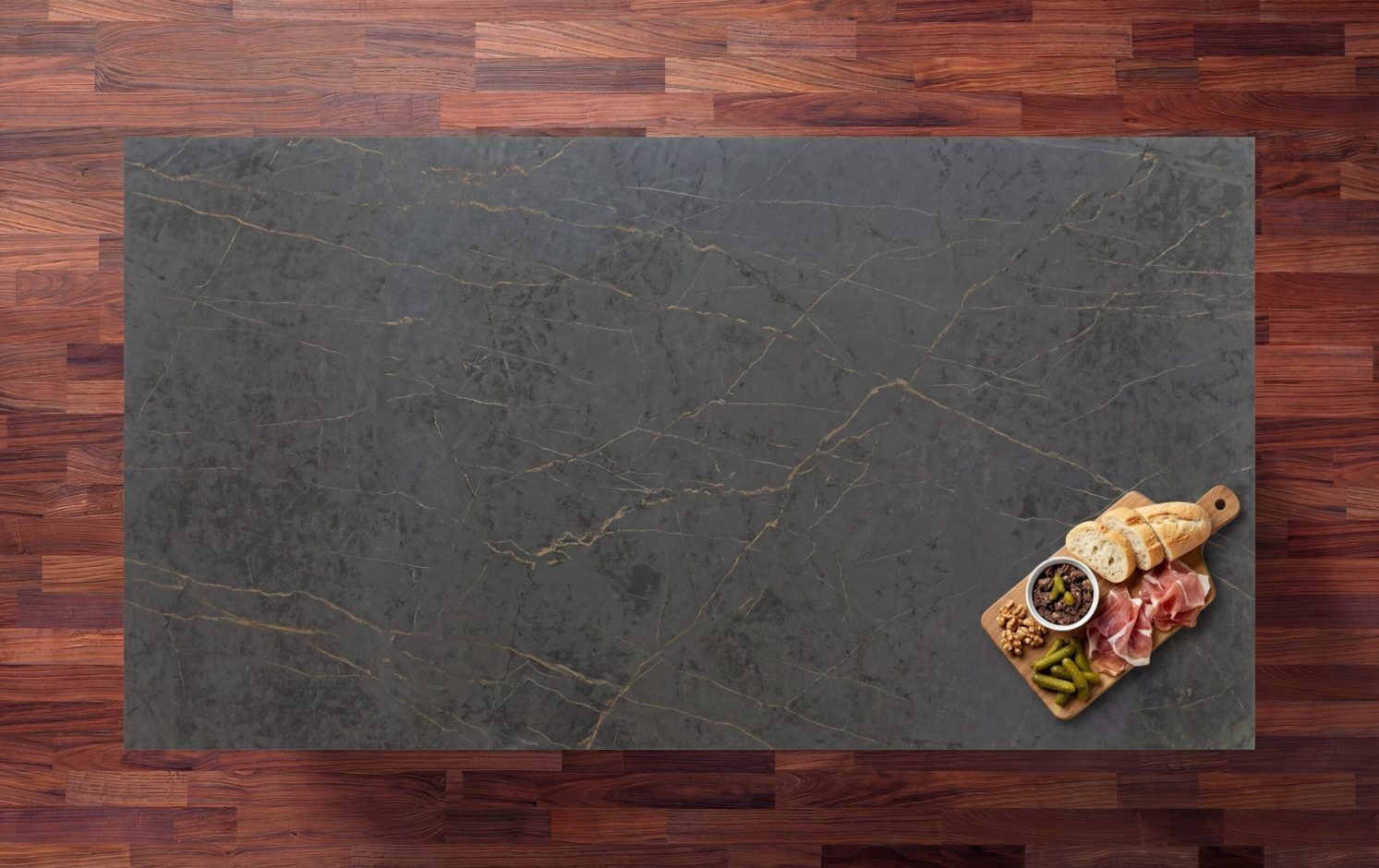 Gold Laurent Porcelain worktop slab shown from above with a dark surface and subtle veining on a wood background