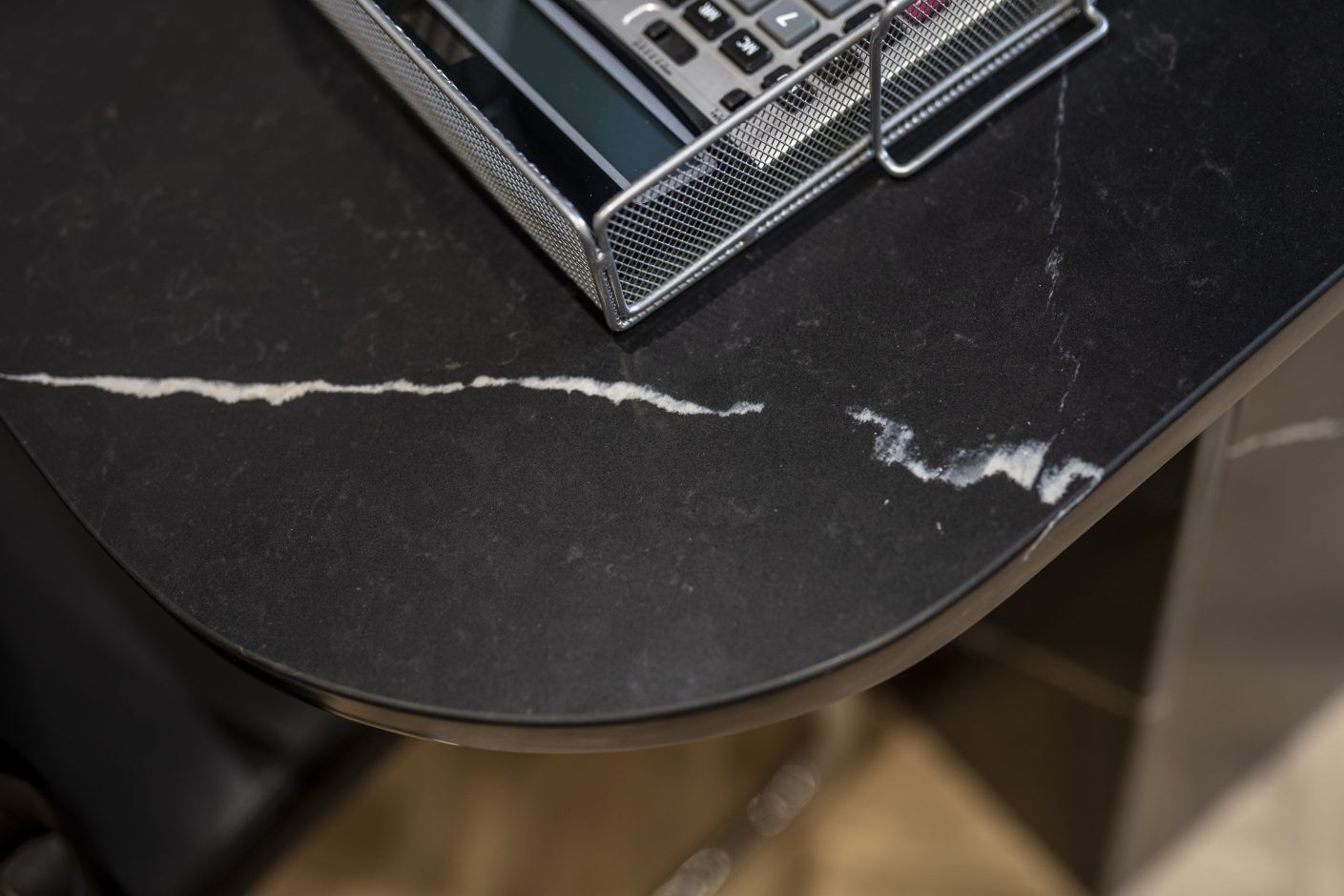 Nero Marquina Quartz worktop corner close-up showing polished black surface with fine white veining
