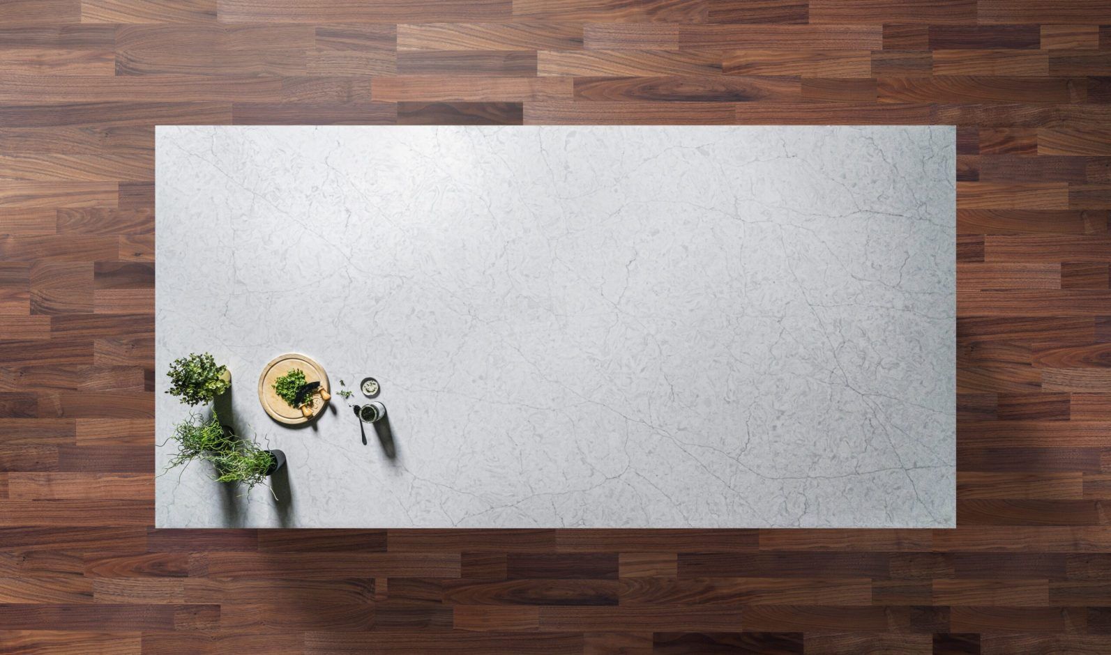 Super White Quartz worktop shown from above with a fine speckle texture across a pale grey-white surface