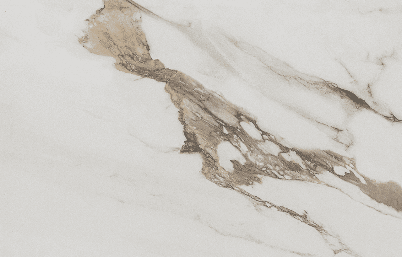 Macchia Antica Porcelain close-up with warm gold veining and soft grey movement across a white surface