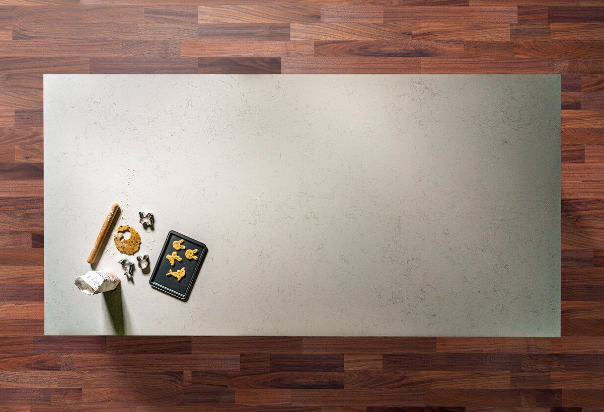 Full Carrara Quartz slab showing soft grey veining on a smooth white surface