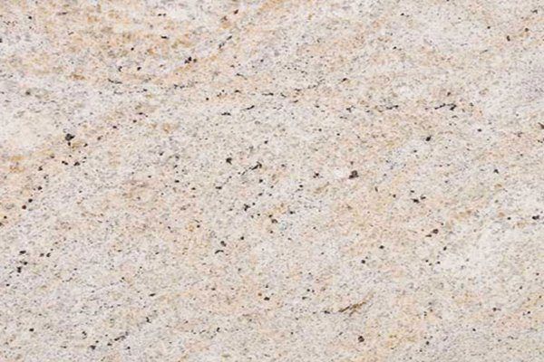 Close up slab photo of Ivory Fantasy Granite showing light beige tones with fine speckling and natural colour variation.