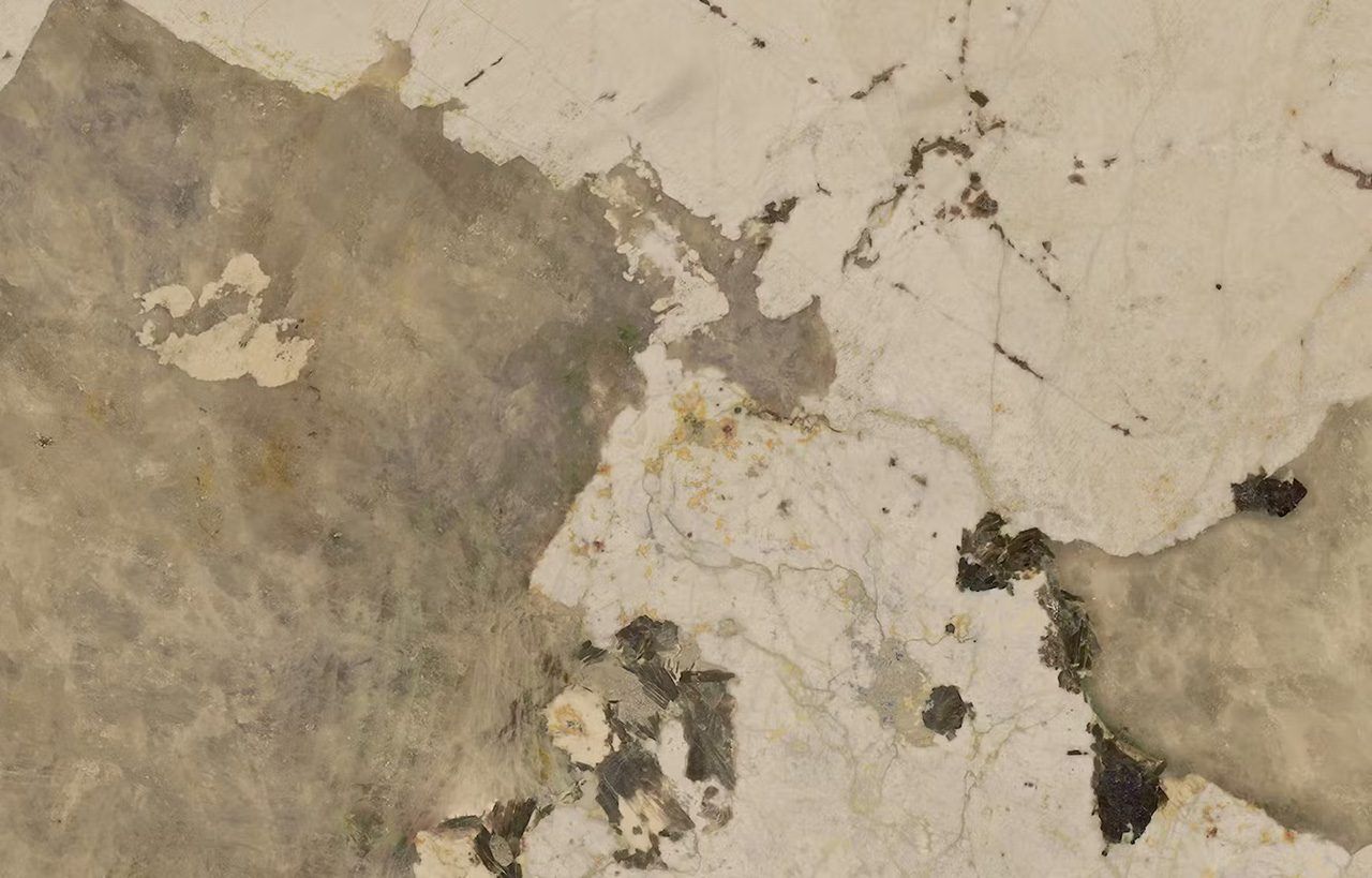 Close up of Khalo Porcelain in creamy white with warm taupe veining, soft gold tones and natural mineral style movement