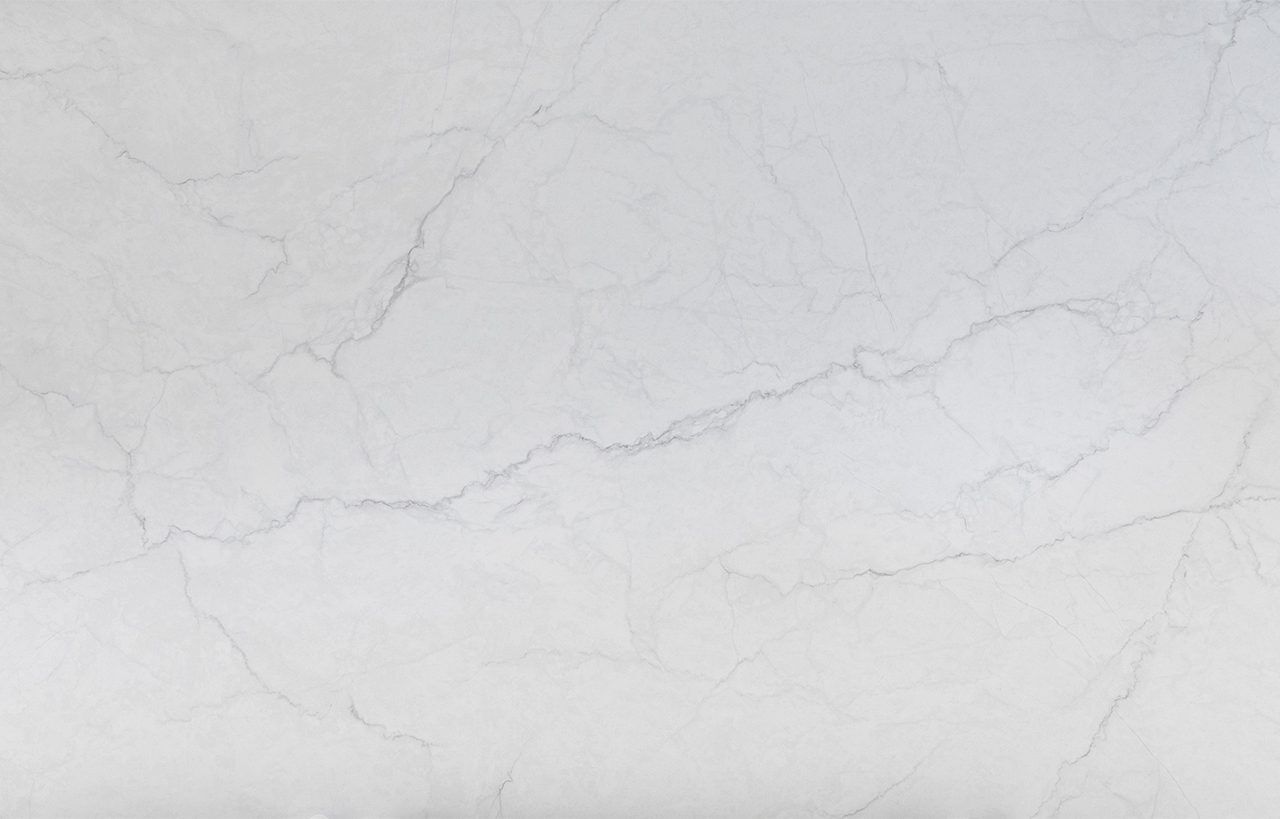 Statuario Venato Porcelain surface detail with very light grey veining and a clean, bright white finish.