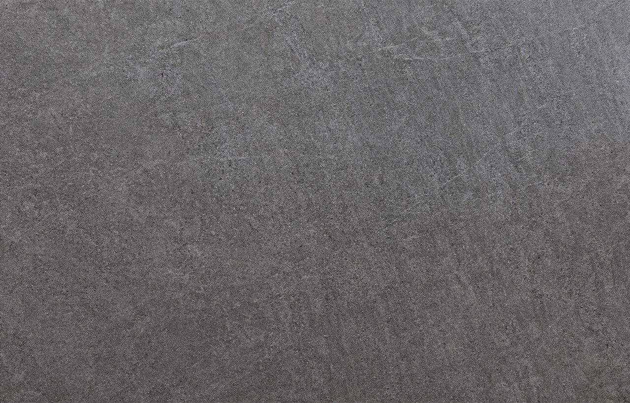 Pierre Bleue Porcelain surface detail showing dark grey stone effect texture