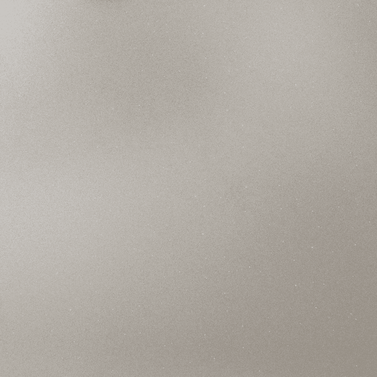 Aluminum Quartz slab close-up showing soft light grey colour with delicate shimmer and fine grain texture