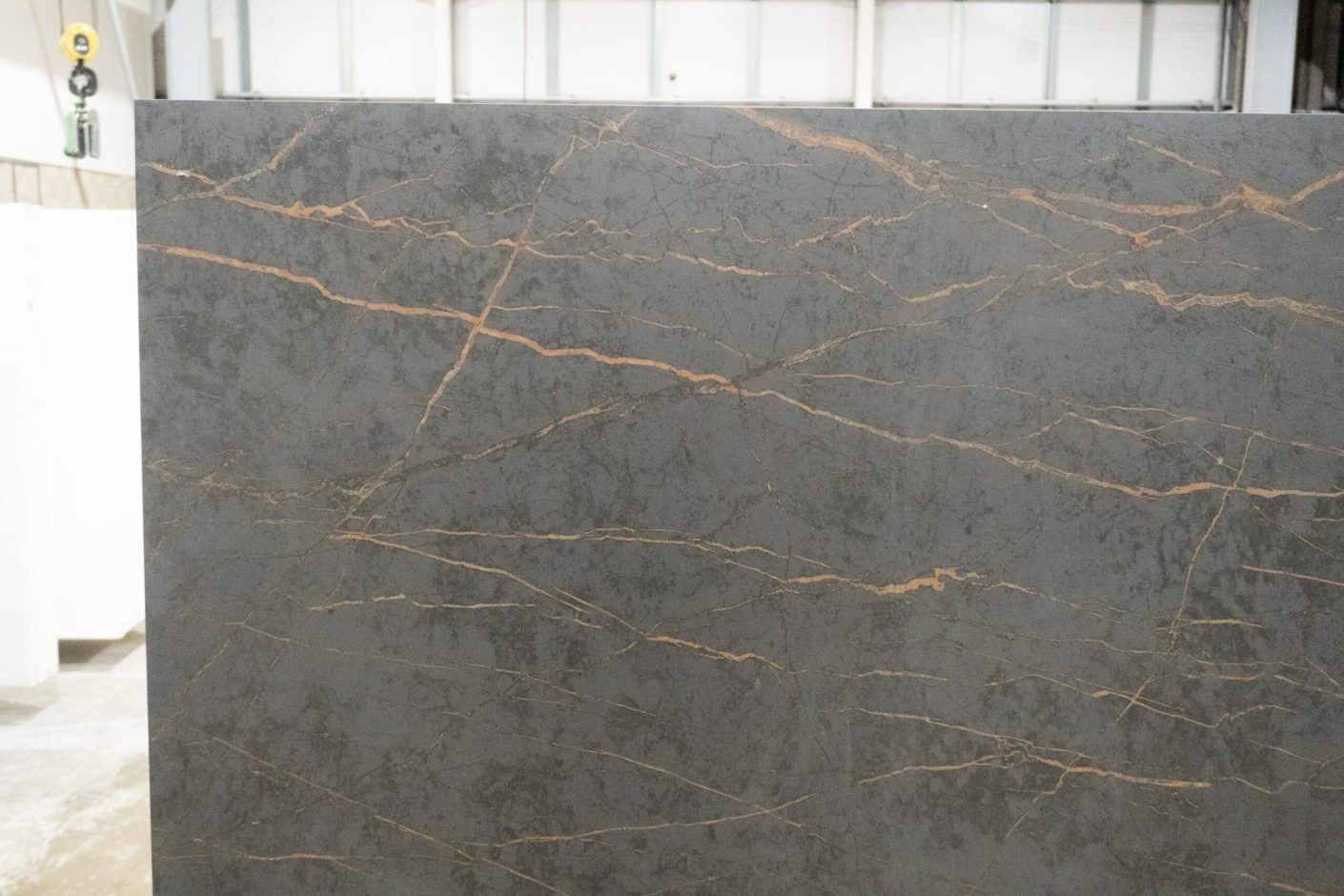 Gold Laurent Porcelain slab face showing fine gold veins spread across a dark grey surface