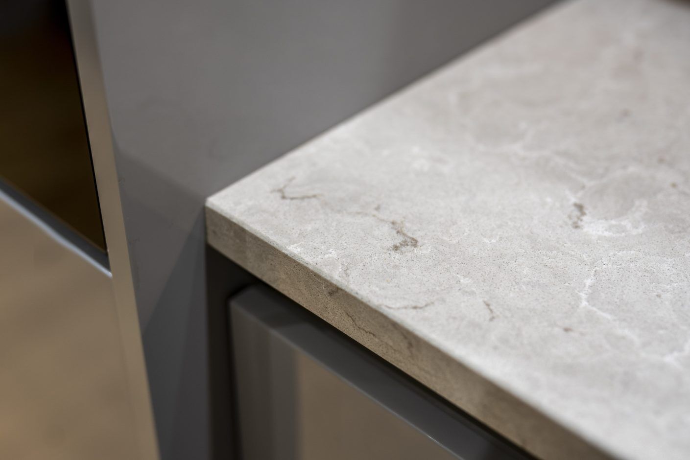 Grey Drift Quartz worktop edge close-up showing corner detail and soft stone-effect movement