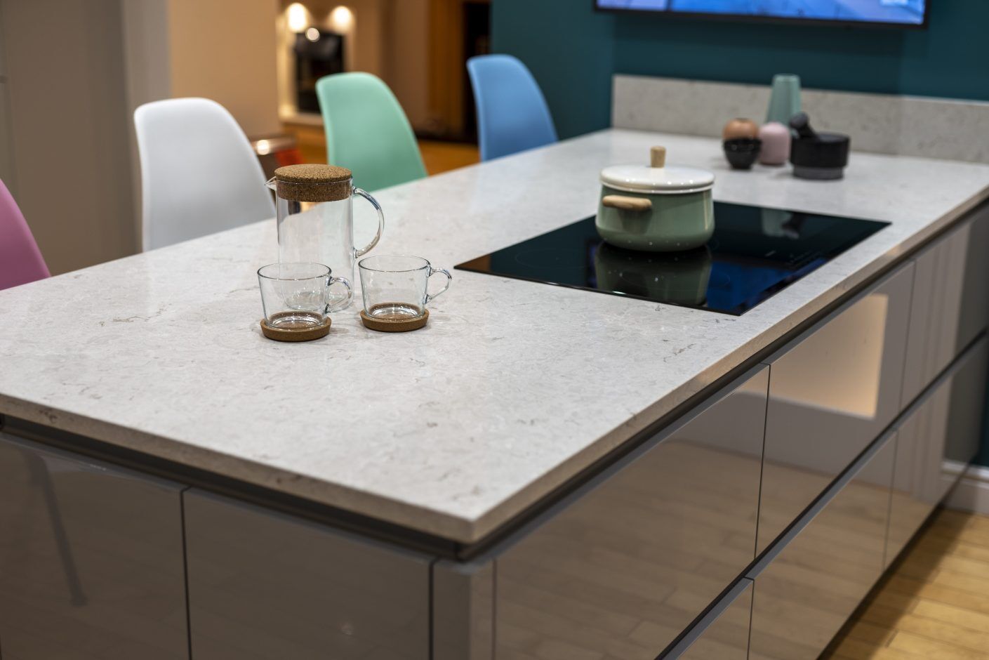 Grey Drift Quartz island worktop with inset hob and clean edge detail in a modern kitchen setting