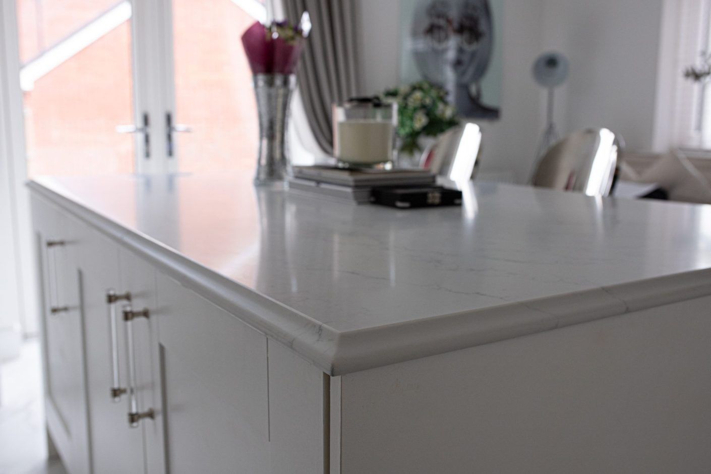 Statuario Bianco Porcelain kitchen island with subtle veining and polished edge detail
