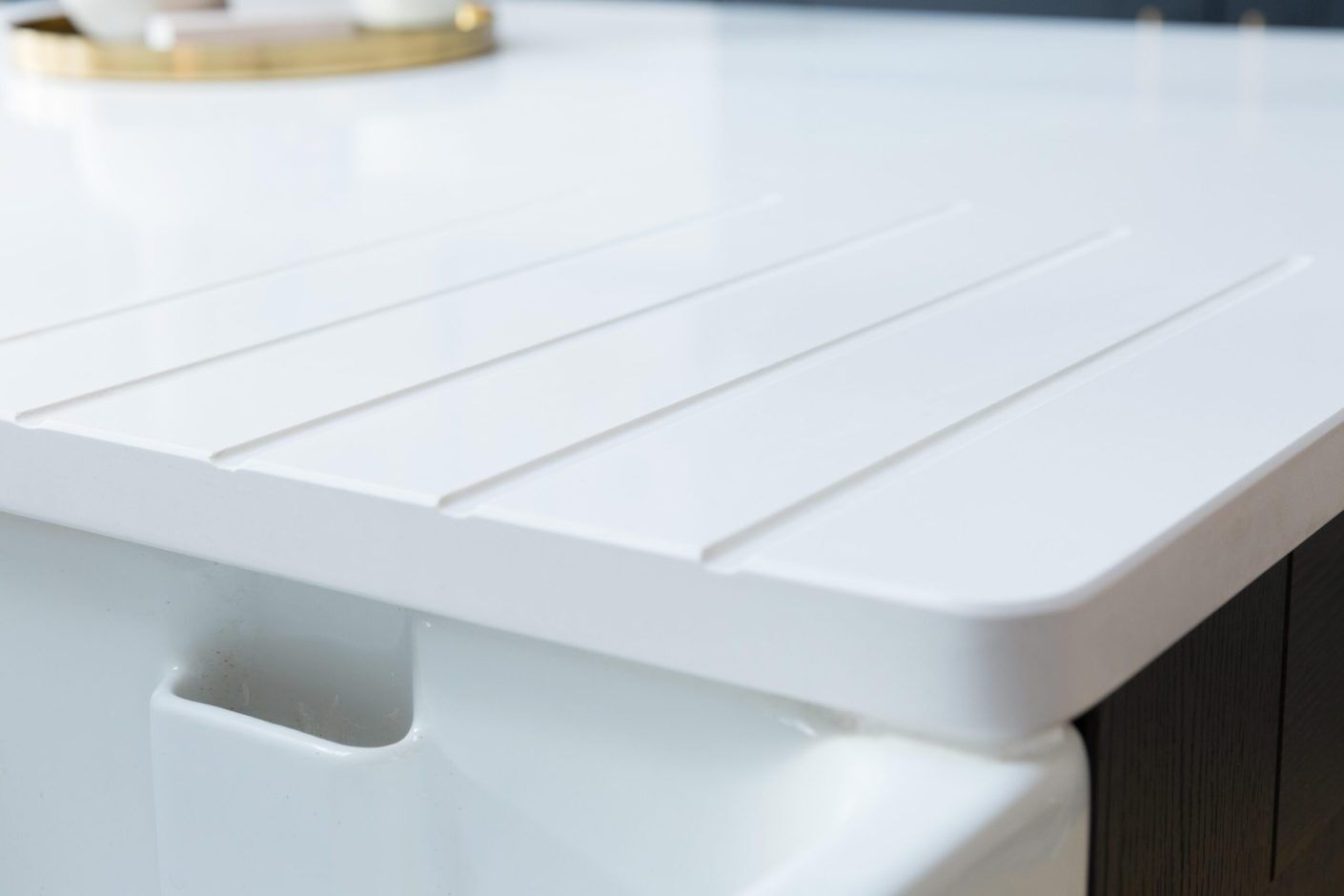 Blanco Zeus Quartz drainer grooves close-up showing crisp channels and a bright white sink run finish