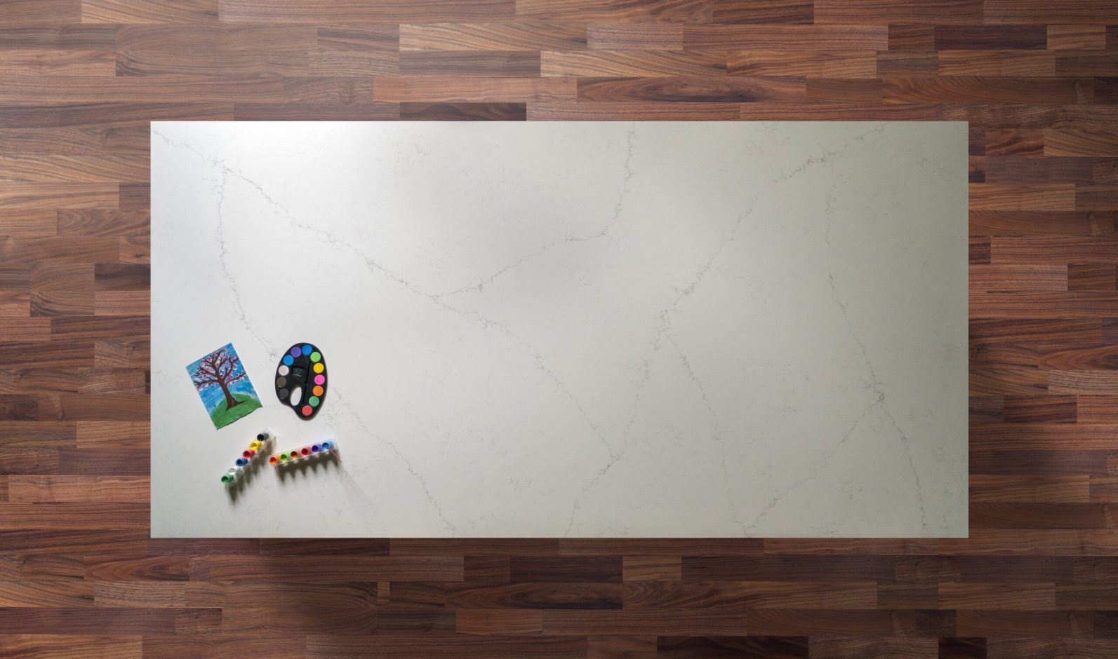Overhead view of an Olympus White Quartz island worktop with subtle grey veining on a smooth white finish