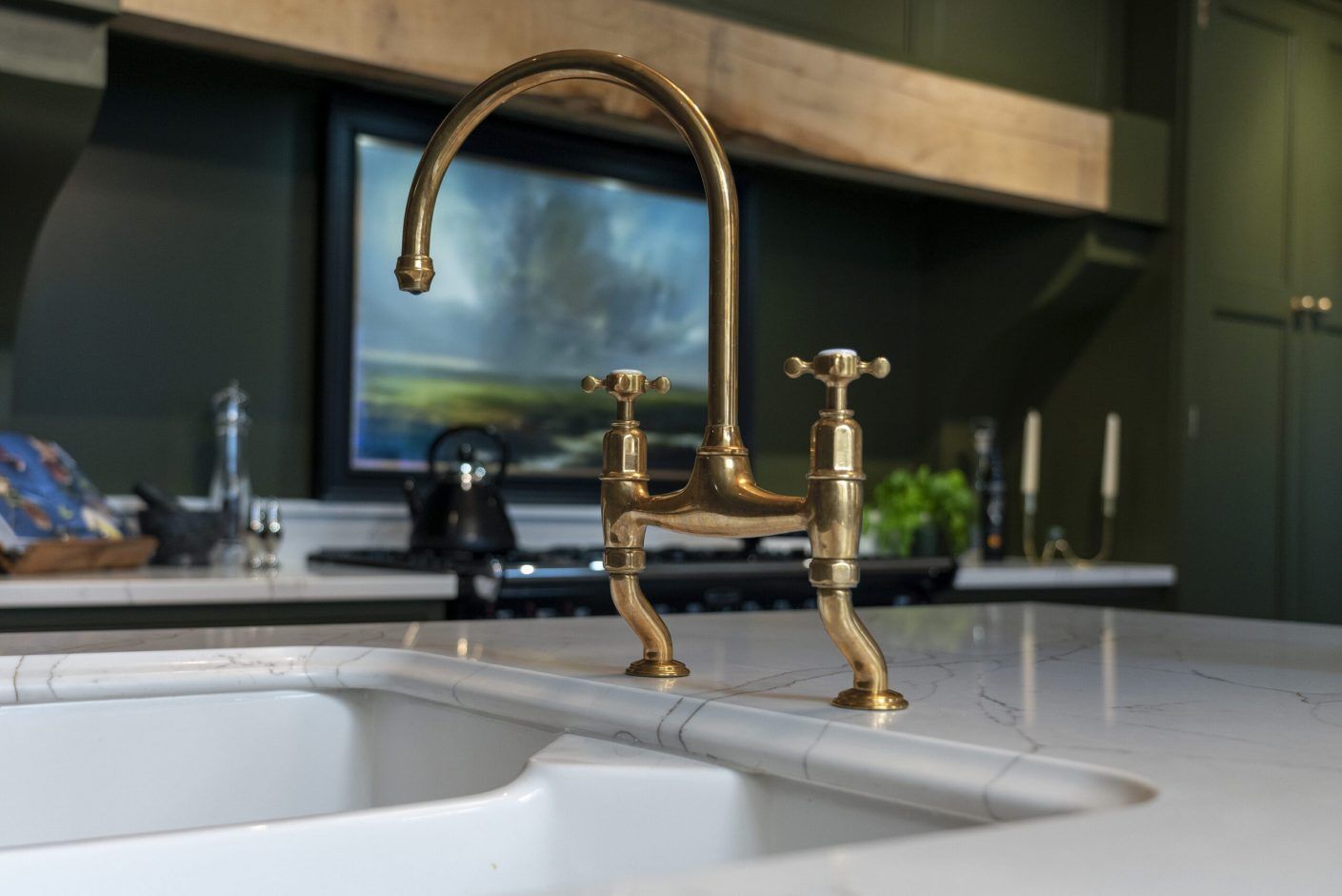 Gold Calacatta worktop with brass tap and undermount sink