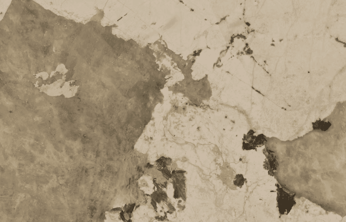 Close up of Khalo Porcelain in creamy white with warm taupe veining, soft gold tones and natural mineral style movement