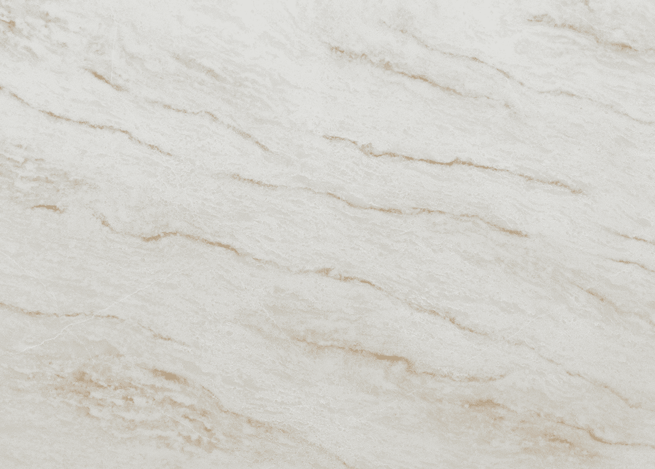Taj Mahal Quartz slab close-up showing a warm white base with soft gold-beige veining