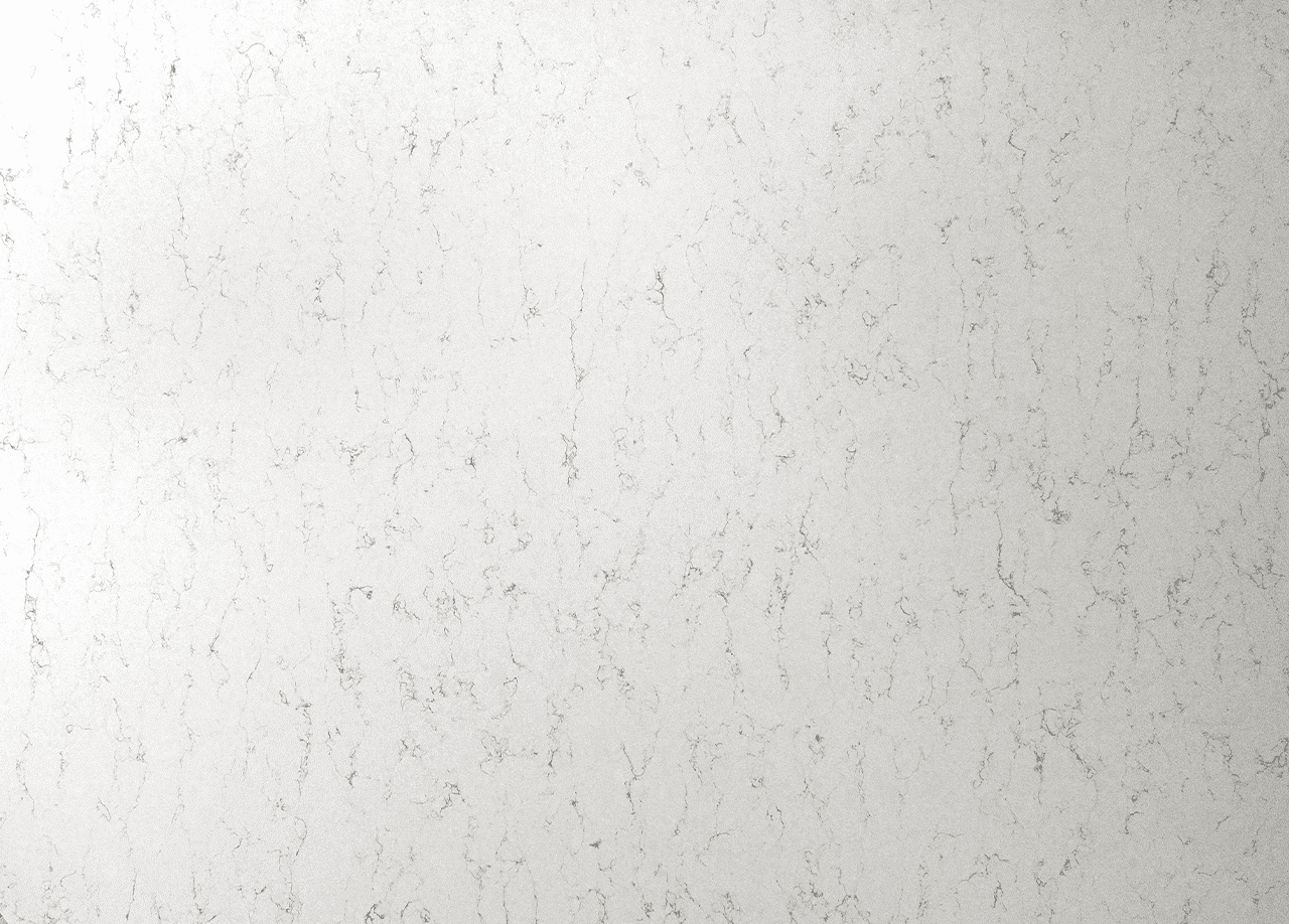 White Arabesque Quartz slab close-up showing soft grey veining and fine marble-effect patterning on a white background