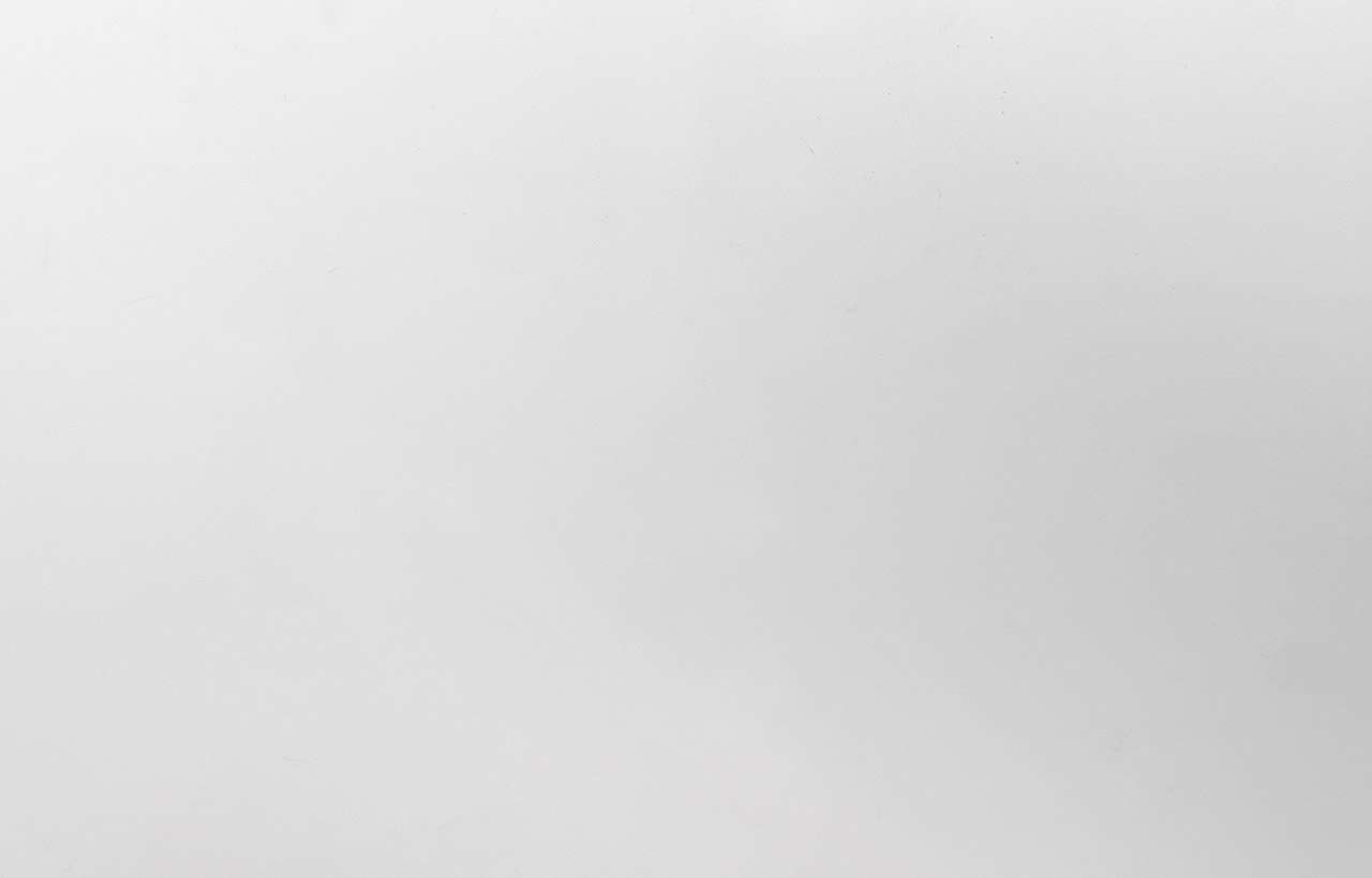 Close-up of Classic White Quartz slab showing a smooth, bright white surface with a uniform finish