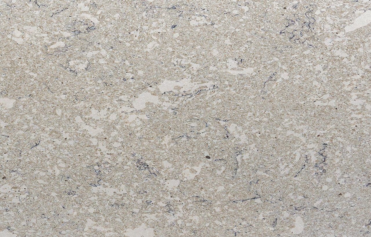 Venetian Drift Quartz slab close-up showing warm grey stone-effect texture with natural flecks and soft movement