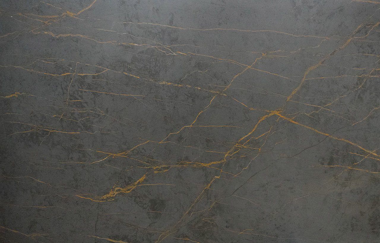 Gold Laurent Porcelain slab close-up showing bold gold veining across a dark grey surface