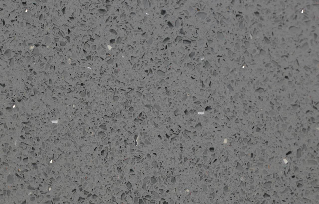 Grey Starlight Quartz close-up showing small reflective grains and speckled texture across the grey slab