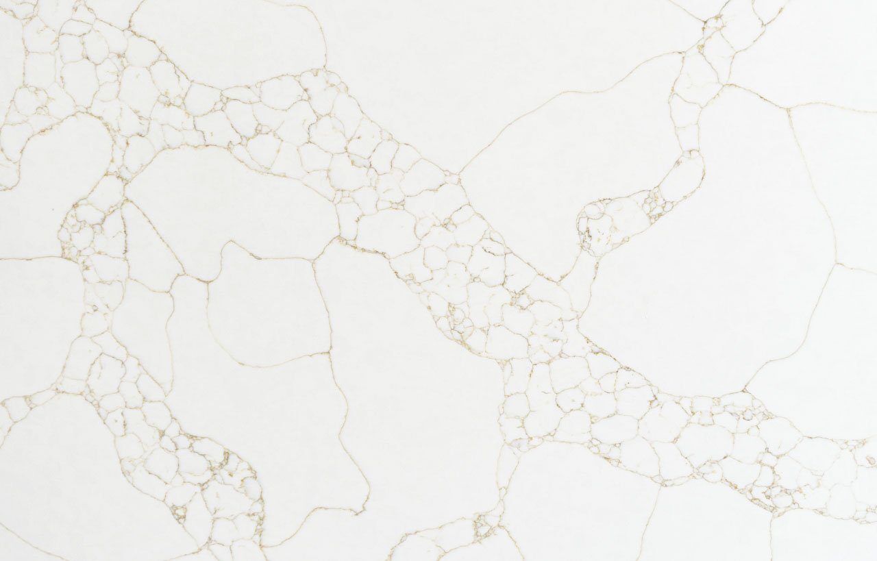 Gold Arabescato Quartz slab close-up showing bold marble-effect shapes with fine gold veining