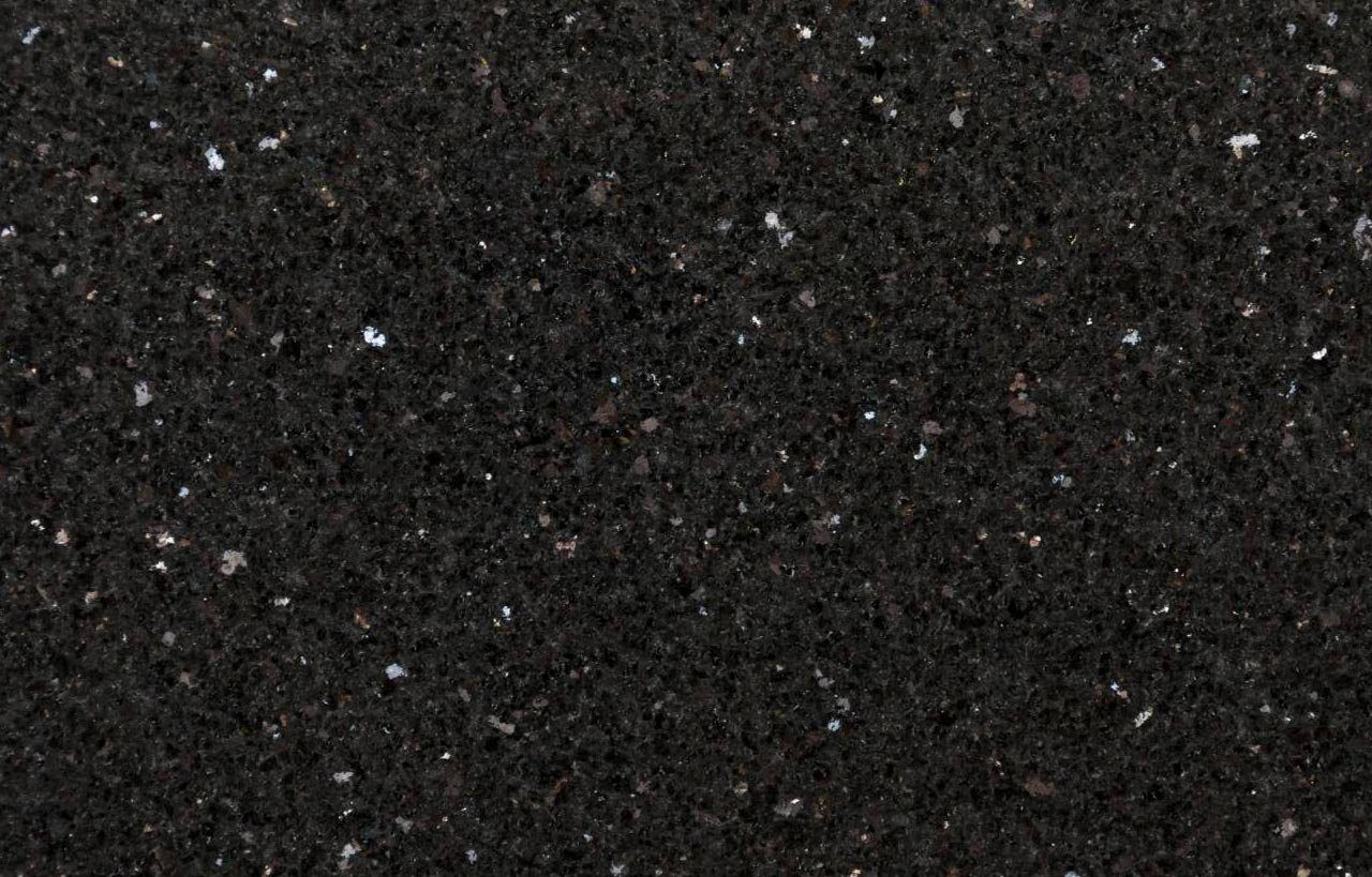 Close up slab photo of Nero Cosmos Granite showing a deep black base with fine sparkling flecks and natural crystal patterning.