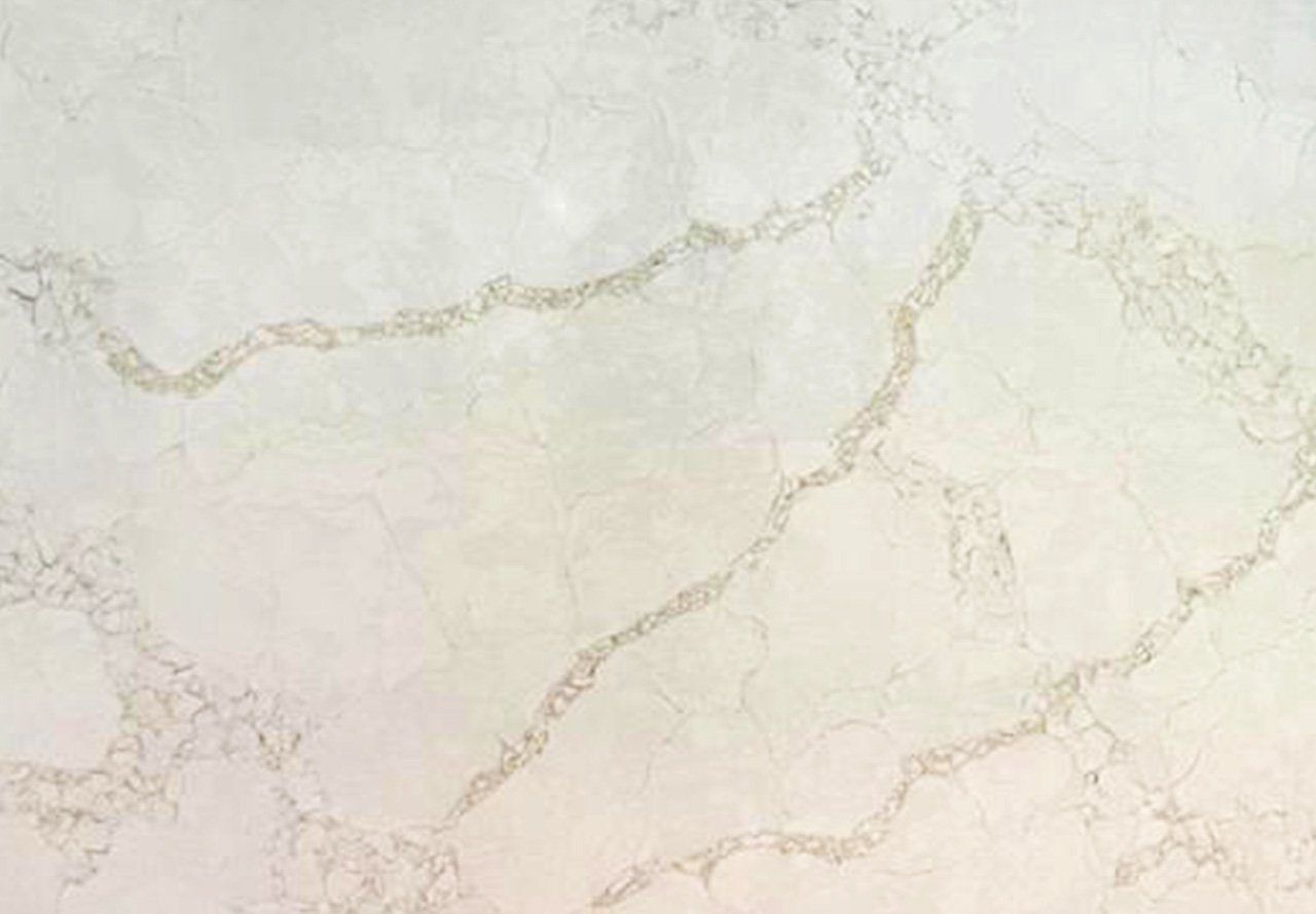 Supreme Calacatta Quartz slab close-up showing soft grey veining with warm accents on a bright white marble-effect surface