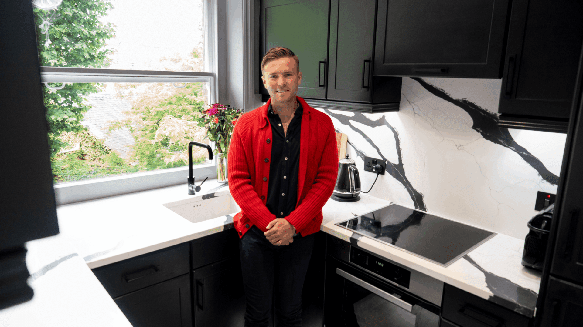 Will testimonial kitchen featuring Black Calacatta Quartz worktops with bold veining and a matching splashback